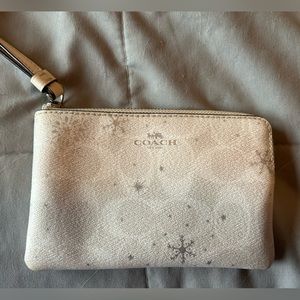 Coach wristlet in winter white with snowflakes
